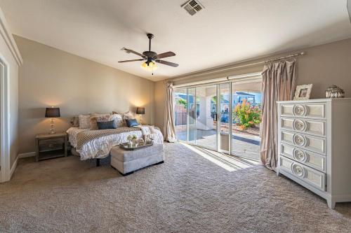 a bedroom with a bed and a ceiling fan at Lake House in Fort Mohave