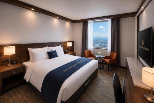 a hotel room with a large bed and a window at Gold Coast Hotel Incheon in Incheon
