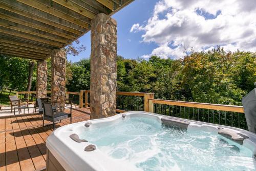 a jacuzzi tub on a deck at Blue Ridge Vista in Seven Devils