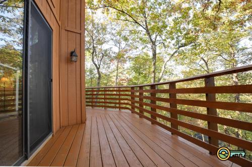 a wooden porch with a glass door on a house at Villa #102 in Basye