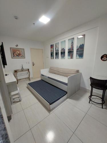 a bedroom with a large bed in a room at Piazza diRoma - Apartamentos JN in Caldas Novas