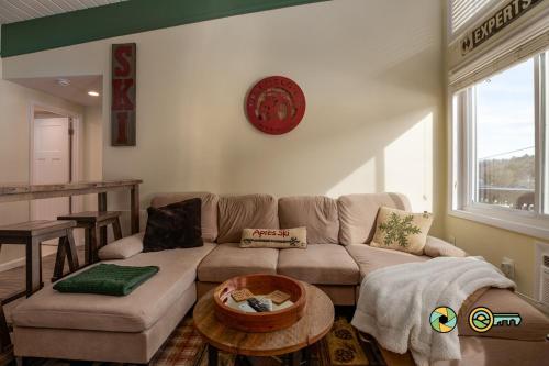 a living room with a couch and a table at Aspen East Unit #231: Slippery Slope in Basye