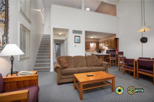 a living room with a couch and a table at Senedo Springs Duplex #97B in Basye