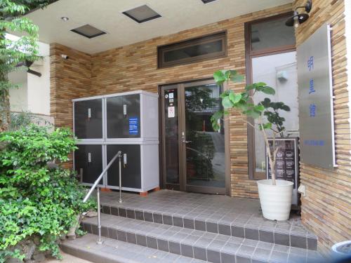 an entrance to a building with a glass door at Hakone Miyanoshita Myojokan in Hakone