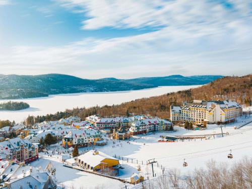 an aerial view of a ski resort in the snow at Fairmont Tremblant in Mont-Tremblant
