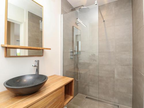 a bathroom with a sink and a glass shower at Aquanaut in Cowes