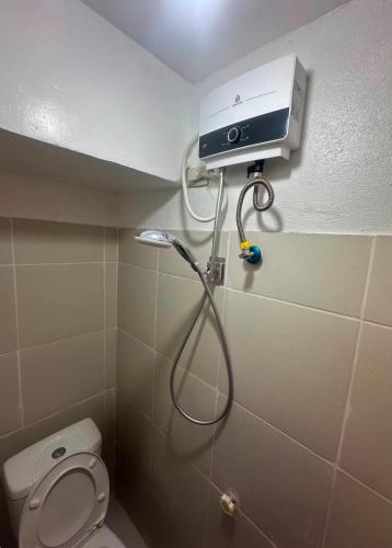 a shower in a bathroom with a toilet at RF Hotel Transient House in Bangued