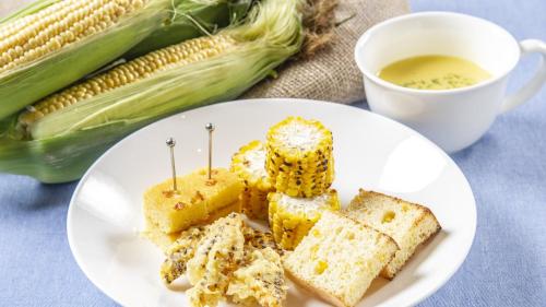 a plate of corn on the cob and a cup of tea at Sapporo View Hotel Odori Park in Sapporo