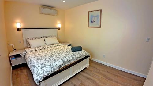 a small bedroom with a bed and a wooden floor at Svitanok in Victoria
