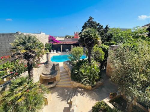 an aerial view of a house with a swimming pool at Wonderful 4BR Farmhouse with Private Pool in Rabat