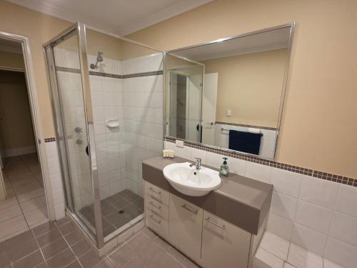 a bathroom with a sink and a shower at Getaway, Unit 20 Seafront Estate in Jurien Bay