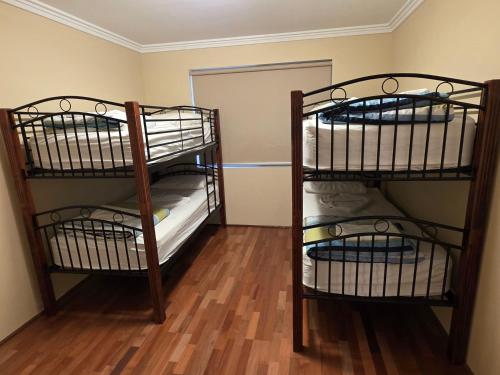 two bunk beds are in a room with a room at Getaway, Unit 20 Seafront Estate in Jurien Bay