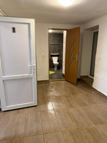 an empty room with a toilet and a door at Thomas in Judenburg
