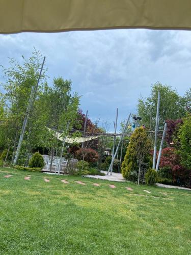 a park with a volley ball net in the grass at Camping Sandalandia in Vama Veche