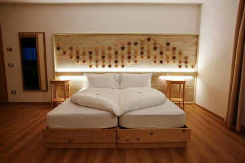 Katil atau katil-katil dalam bilik di Garnì & Wellness Anderle