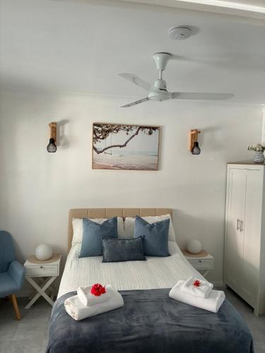 a bedroom with a bed with two towels at Flip flops in Horseshoe Bay