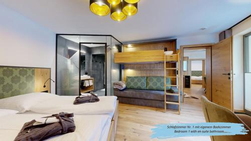 a hotel room with two beds and a mirror at Haus Bergkristall in Sankt Anton am Arlberg