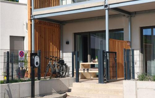 a building with a gate with a bike parked outside at Apartments Kellergasse in Purbach am Neusiedlersee