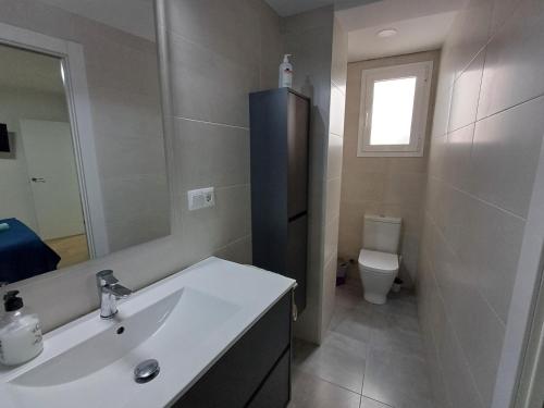 a bathroom with a sink and a toilet at Carbo Home y Garaje , Algemesí Home in Algemesí