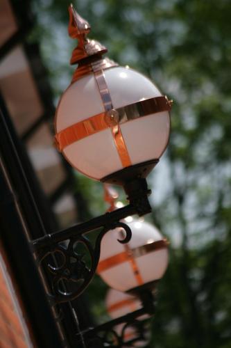 a street light attached to a building at The Pinewood Hotel in Slough