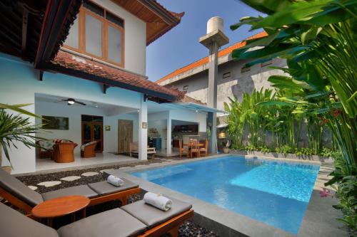 a pool in the backyard of a villa at Hildiman Villa Kuta - Two Bedroom Private pool in Kuta