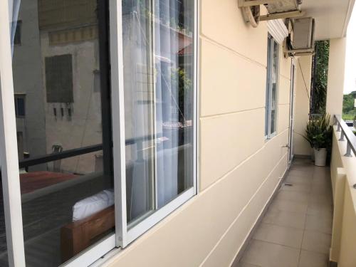 a balcony with a window on a building at Homestay 150 in Ho Chi Minh City