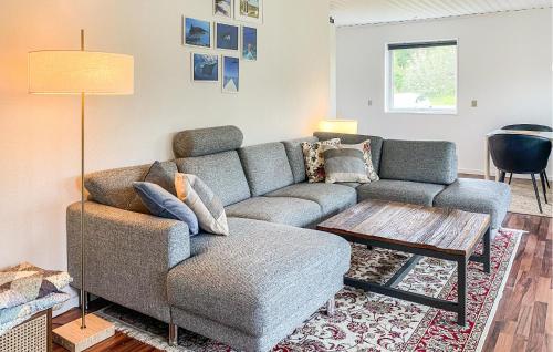 a living room with a couch and a coffee table at Beautiful Home In Holbæk With Wifi in Holbæk