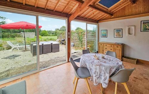 a dining room with a table and chairs at 2 Bedroom Gorgeous Home In Noyal-Sous-Bazouges in Noyal-sous-Bazouges