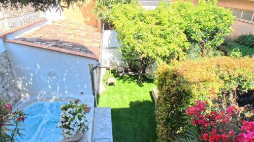 an aerial view of a garden with a swimming pool at Villa al Duomo Taormina - Suite & Rooms in Taormina
