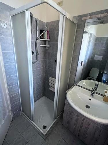 a bathroom with a shower and a sink at Appartamento Treviglio-centro in Treviglio