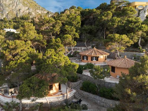 an aerial view of a house on a mountain at Seafront Collection - Bungalows and Villas in Aspra