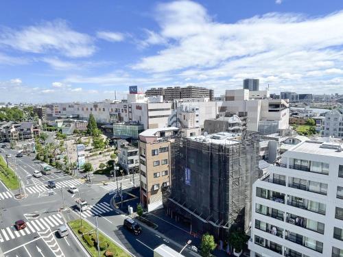 an overhead view of a city with buildings and a street at Kameari 1110 - 11F Newly Renovated High Floor City View 2min to Mall 5min to Station Disney Access in Tokyo