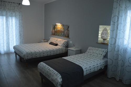 Postel nebo postele na pokoji v ubytování B&B Maison Blanche