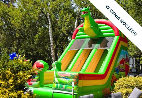 a colorful inflatable bounce house at a park at Prawdzic Family Resort & Wellness in Gdańsk