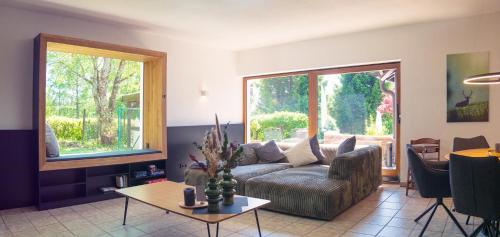 a living room with a couch and a table at Ferienhaus 76 in Freudenstadt