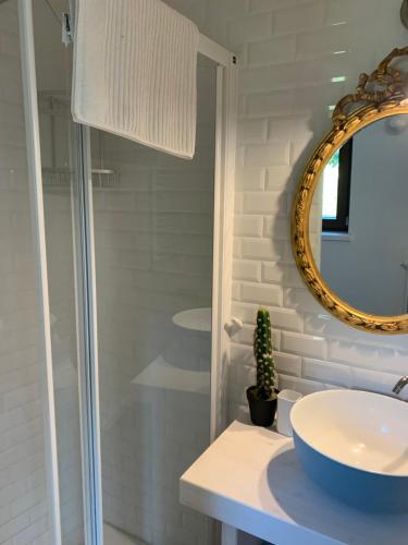 a bathroom with a sink and a mirror at Il giardino di Lallo in Barrea
