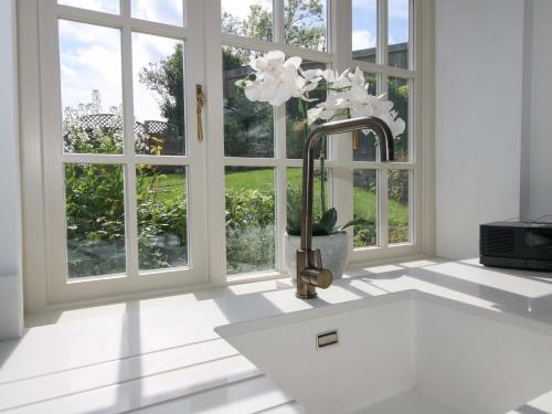 a kitchen with a sink and a window at 5 Shrewsbury Road in Much Wenlock
