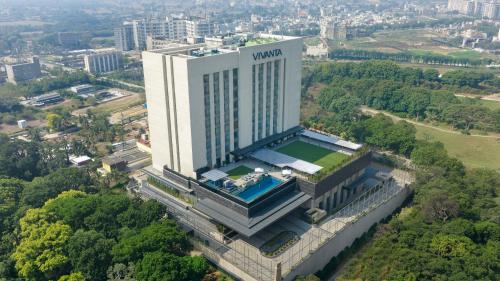 an overhead view of a building with a pool on it at Vivanta Vrindavan in Vrindāvan