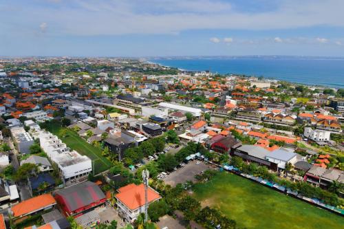 an aerial view of a city with the ocean at M4YA Berawa in Canggu