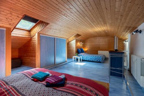 a bedroom with a large bed in a house at Chez Corinne in Cornimont