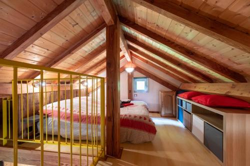 a bedroom with two bunk beds in a log cabin at Chalet Chez Corinne in Cornimont