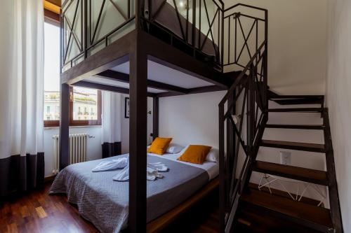 a bedroom with a bunk bed and a spiral staircase at Toledo Apartment until 7 people 2 bathrooms in Naples