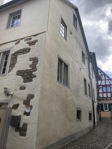 a white building with some windows on the side of it at Altstadtmeise Rustika in Meisenheim