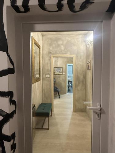 a hallway with a door leading into a room at Ema's double bedroom in Umag