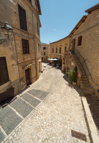 an empty alley in an old building with stairs at Malù Cozy Borgo Retreat in Casperia