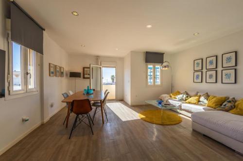 a living room with a couch and a table at Caracolas Luxury House Duplex in Tarifa