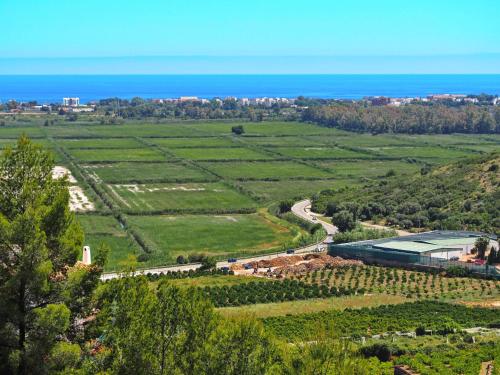 an aerial view of a field with the ocean at Holiday Home Del Azahar by Interhome in Monte Pego