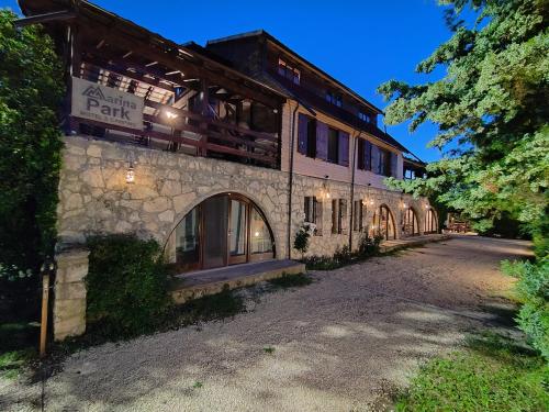 a large stone building with a street in front of it at Marina Park Camping in Vama Veche