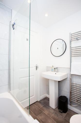 a bathroom with a sink and a shower at Arkless Grove FREE Parking WiFi in Black Hill