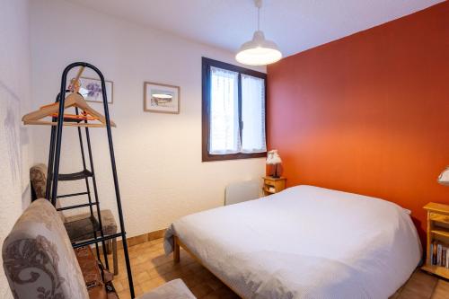 a bedroom with a bed and a ladder in it at Central Parc T2 Pour 4 Pers in Briançon